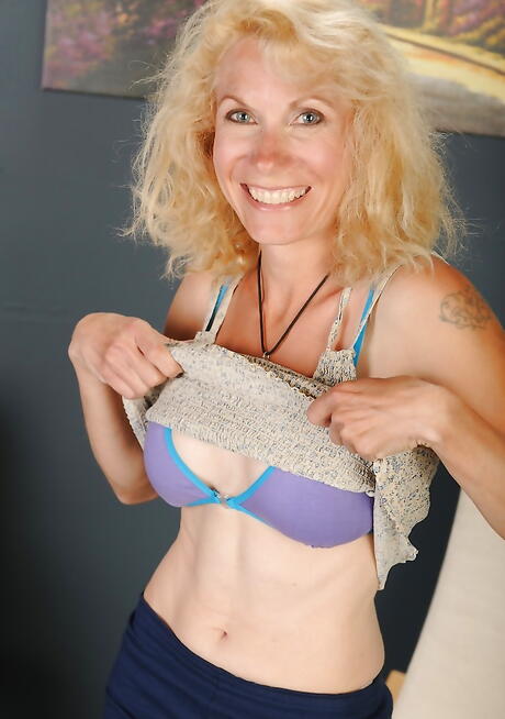 Sultry aged Shay Nollen bares big knockers and shaved pussy 