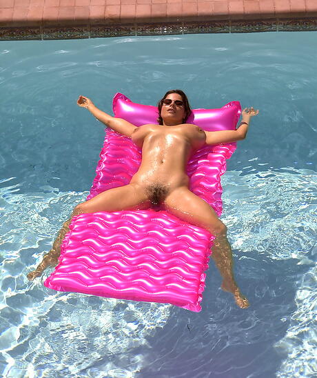 Alluring german milf Chloe Vevrier exposes big tits and spreads her legs at pool