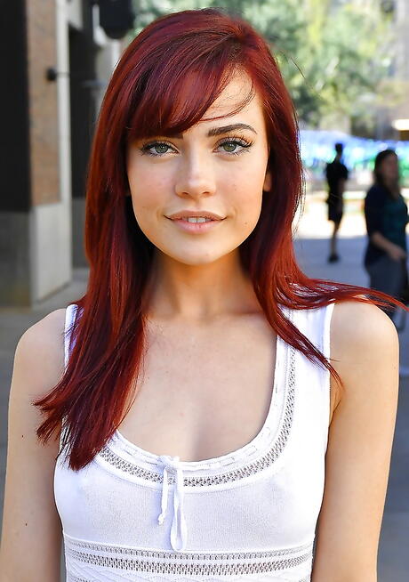 Slender american redheaded young Sabina Rouge in fancy skirt exposing tiny tits and spreading her legs outdoor